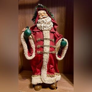 Vintage Paper Mache Santa Claus figure with toy bag.